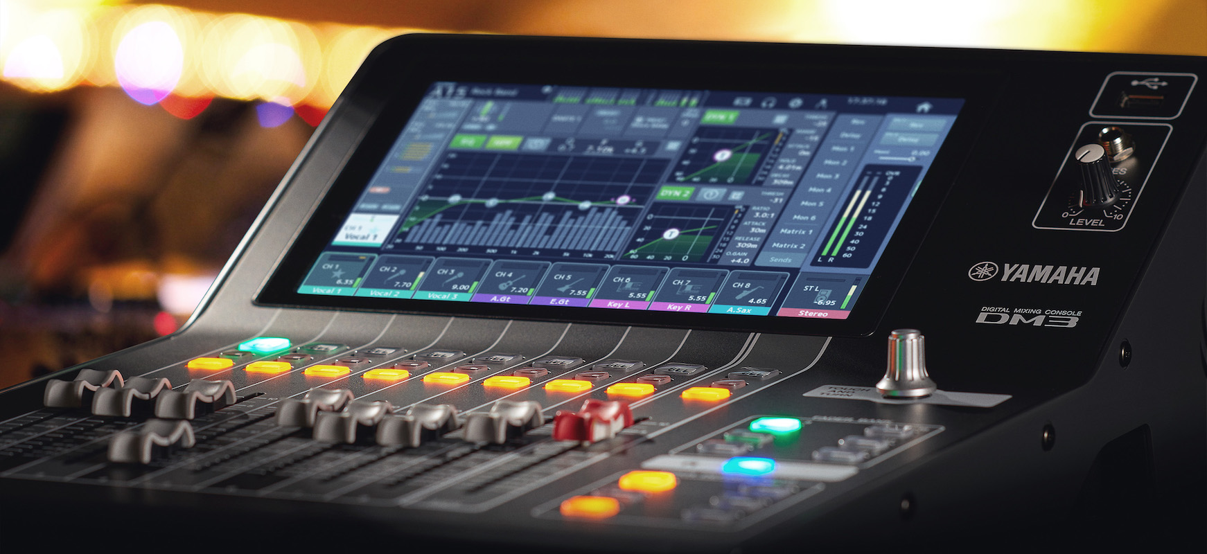 Close up view of the DM3 focused on the center of the mixing console.