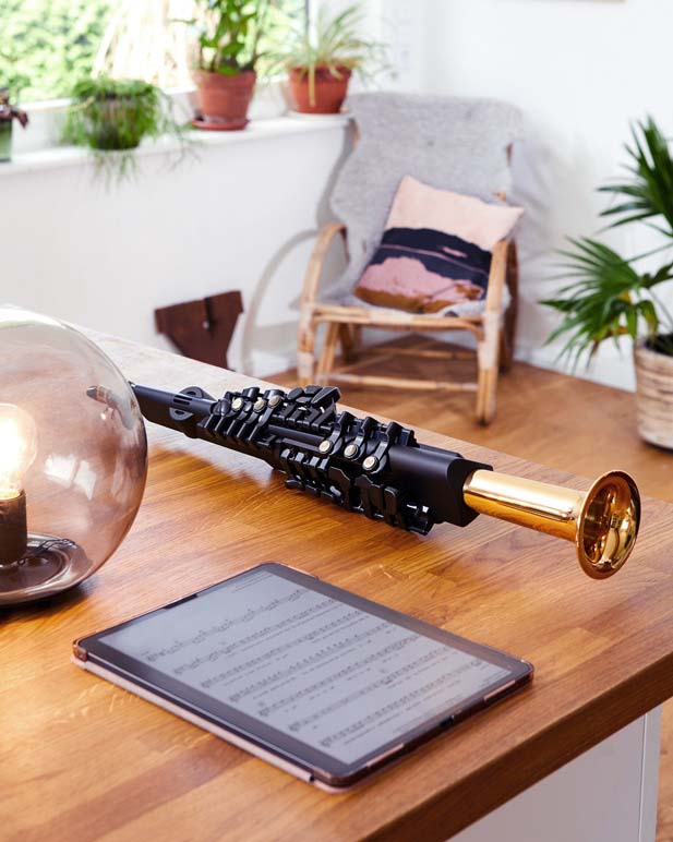 The Yamaha YDS-150 Digital saxophone placed on a table.