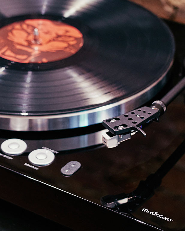 Closeup of a record vinyl on a Yamaha record player.
