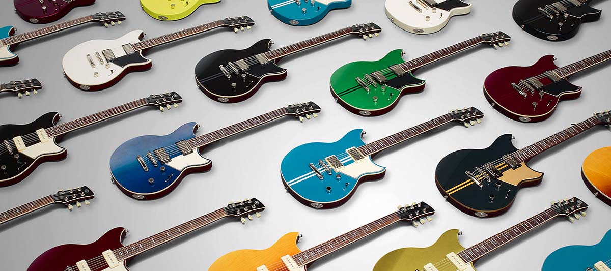 Image of several models and colors of the Revstar guitar.