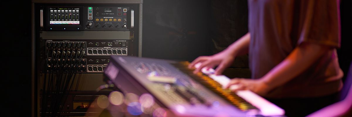 TF-RACK in action on stage with keyboard player in foreground.