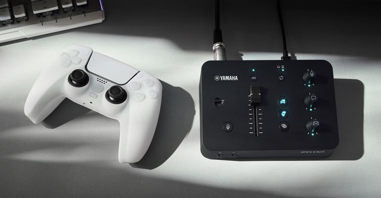 ZG02 and a gaming controller pictured together.